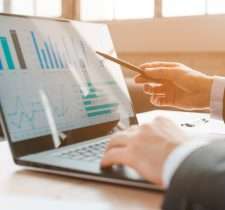 Reviewing financial portfolios and income statements